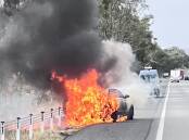 A car erupted in flames on the Hume Highway on Thursday afternoon. Picture by RFS.